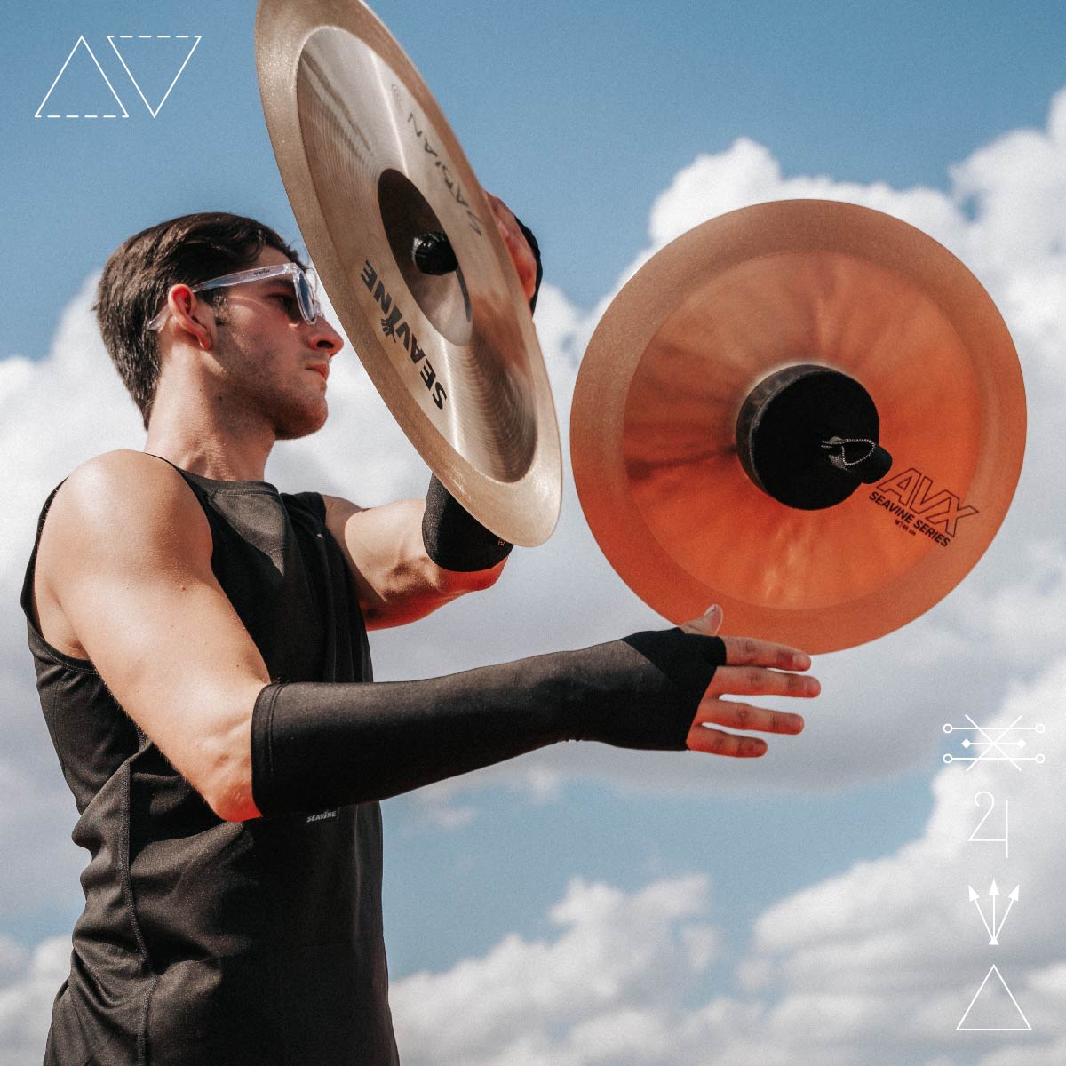 A male cymbalist juggling AVX cymbals, made for marching cymbal visuals such as off-hand release and reloads as well as juggling